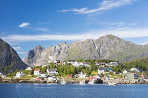 Moskenesoya Prints: The blue sea frames the fishing village and the rocky peaks