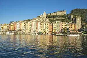 The blue sea frames the typical colored houses of Portovenere, UNESCO World Heritage Site