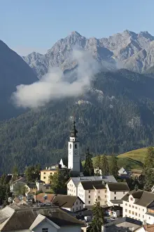 Blue sky on the alpine village of Ftan surrounded by rocky peaks, Inn district, Canton