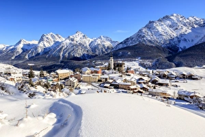 Blue sky on the alpine village of Ftan surrounded by snow, Inn district, Canton of Graubunden