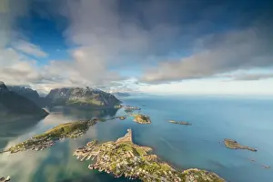 Moskenesoya Prints: Blue sky and clouds frame the turquoise sea and the typical village, Reinebringen