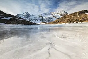 Blue Ice Prints: Blue sky and clouds on frozen Lej Nair surrounded by snowy peaks, Bernina Pass, Canton