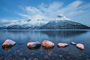 Blue Colour Prints: Blue sky at dusk and snowy peaks are reflected in the frozen sea, Storfjorden, Lapland