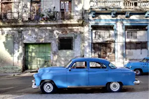 Vintage Car Prints: Blue vintage American car parked on a street in Havana Centro