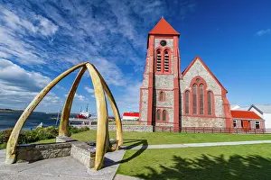 Whale Prints: Blue whale mandibles frame Anglican Christ Church Cathedral in Stanley