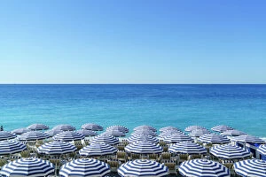 French Culture Gallery: Blue and white beach parasols, Nice, Cote d Azur, Alpes-Maritimes, Provence, French Riviera