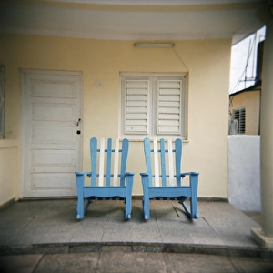 Vinales Prints: Blue and white chairs against a yellow wall, Vinales, Cuba, West Indies, Central America