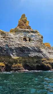 Wanderlust Prints: Boat exploring the coastline with rock formations near Carvoeiro in Algarve Portugal during a sunny day