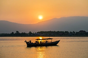 Four People Prints: Boat on the Kampot River at sunset, Kampot, Kampot Province, Cambodia, Indochina