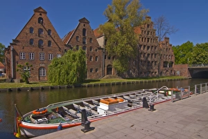 Boat on a little channel in front of the salt warehouses, Lubeck, UNESCO World Heritage Site
