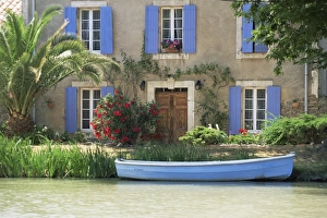 Aude Prints: Boat moored alongside house on the bank of the Canal du Midi, Le Somail