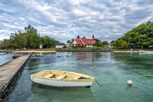 Cap Malheureux Prints: Boat moored in the sea surrounding the Notre Dame Auxiliatrice Church, Cap Malheureux