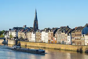 Limburg Prints: A boat passes buildings along the Meuse (Ms) River in the Wyck-Ceramique quarter