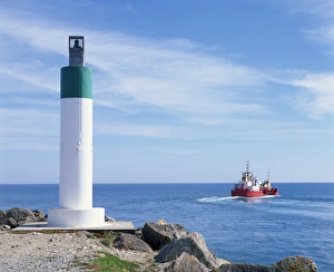 Tasman Sea Prints: Boat in the Tasman Sea outside the harbour entrance at Westport