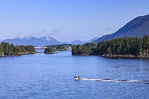 Sitka Prints: Boat travels through small forested islands, clearing morning mists, rare Summer sun