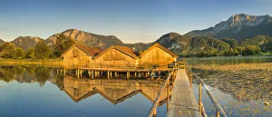 Boathouse Prints: Boathouses at Kochelsee Lake at sunset