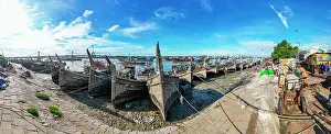 Fresh Prints: Boats anchor along the Karnaphuli River at a fish market in Chittagong