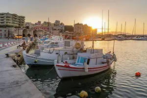 Fisherman Prints: Boats docked at Heraklion Venetian Port during sunset in Crete