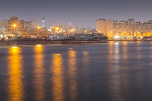 Boats on Dubai Creek at dusk, Bur Dubai, Dubai, United Arab Emirates, Middle East