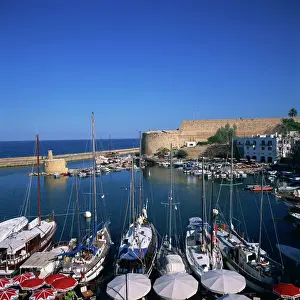 Cyprus Prints: Boats in harbour and Kyrenia castle built by Lusignans between 1192 and 1211