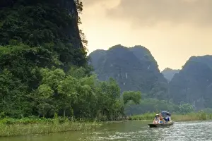 Passenger Prints: Boats in the karst landscapes of Tam Coc and Trang An in the Red River area, UNESCO