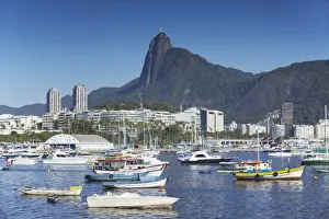 Christ The Redeemer Prints: Boats moored in harbour with Christ the Redeemer statue in background