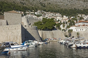 City Walls Prints: Boats moored in the shelter of the walls of the Old City