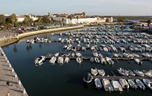 Docked Prints: Boats at moorings in the evening inn the marina in the harbour at Faro