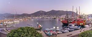 Vessel Prints: Boats in Port of Limenas Chersonisou at dusk with hills in the background in Crete, Greece