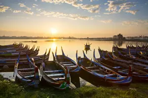 Boats on the Taungthaman Lake near Amarapura with the U Bein teak bridge behind, Mandalay