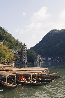 Images Dated 8th November 2008: Boats tied up on a river in the old town of Fenghuang, Hunan Province, China, Asia