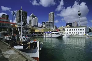 Boats on waterfront with skyline including Sky City Tower beyond