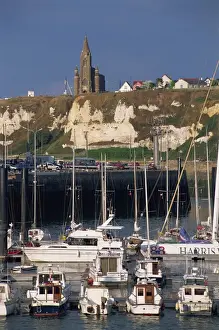 Dieppe Prints: Boats and yachts in the harbour and church on skyline above cliffs, Dieppe