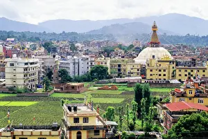 Meditation Prints: Bodnath Temple rises above Kathmandu with surrounding buildings and fields in the distance