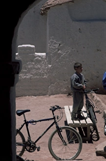 Elementary Age Prints: Boy and bike, San Pedro de Atacama, Chile, South America