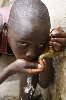 Boys Prints: Boy drinking water, Dakar, Senegal, West Africa, Africa