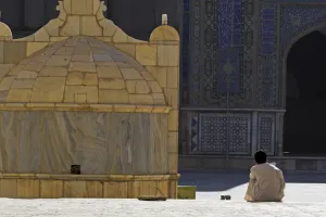Masjid E Jam Prints: Boy praying in courtyard of Friday Mosque (Masjet-e Jam) (Masjid-e Jam) (Masjid-I-Jami)