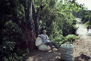 Adolescent Prints: Boy waits along roadside with bags of peanuts, on the outskirts of El Cadillar