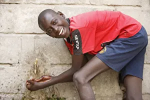 Boys Prints: Boy washing hands, Dakar, Senegal, West Africa, Africa
