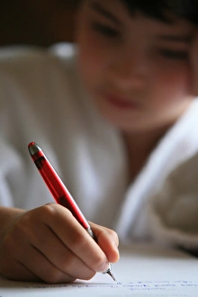 Images Dated 20th April 2006: Boy writing a letter, France, Europe