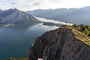 Looking At View Prints: Breathtaking view at sunrise of Kananaskis Lake from peak of hike