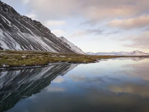 Voyages Prints: Breathtaking winter landscape of Iceland featuring snow-capped mountains