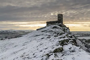 Brentor Church on a snowy outcrop on a winter morning, Dartmoor, Devon, England