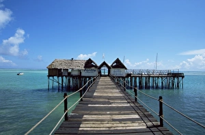 Bridge leading to a bar on the water, Kiwengwa beach, Zanzibar, Tanzania