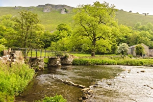 Bridge across River Wye, stone farm buildings, Monsal Dale, spectacular limestone scenery