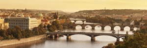 Bridges over the Vltava River including Charles Bridge, UNESCO World Heritage Site, and the Old Town Bridge Tower at sunset, Prague, Bohemia, Czech Republic, Europe
