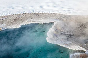 Thermal Pool Prints: Bright blue thermal feature in snow, Yellowstone National Park