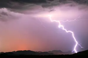 Electricity Prints: A bright lightning strike illuminating the Buckeye Foothills in Arlington during