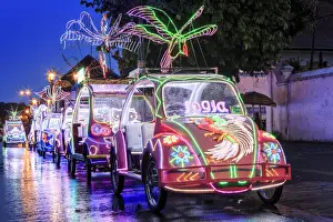 Parked Prints: Brightly coloured illuminated pedal cars in Yogyakarta city