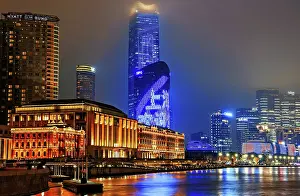 Nightlife Prints: Brightly lit Shanghai city view at night shrouded in mist at the Bund